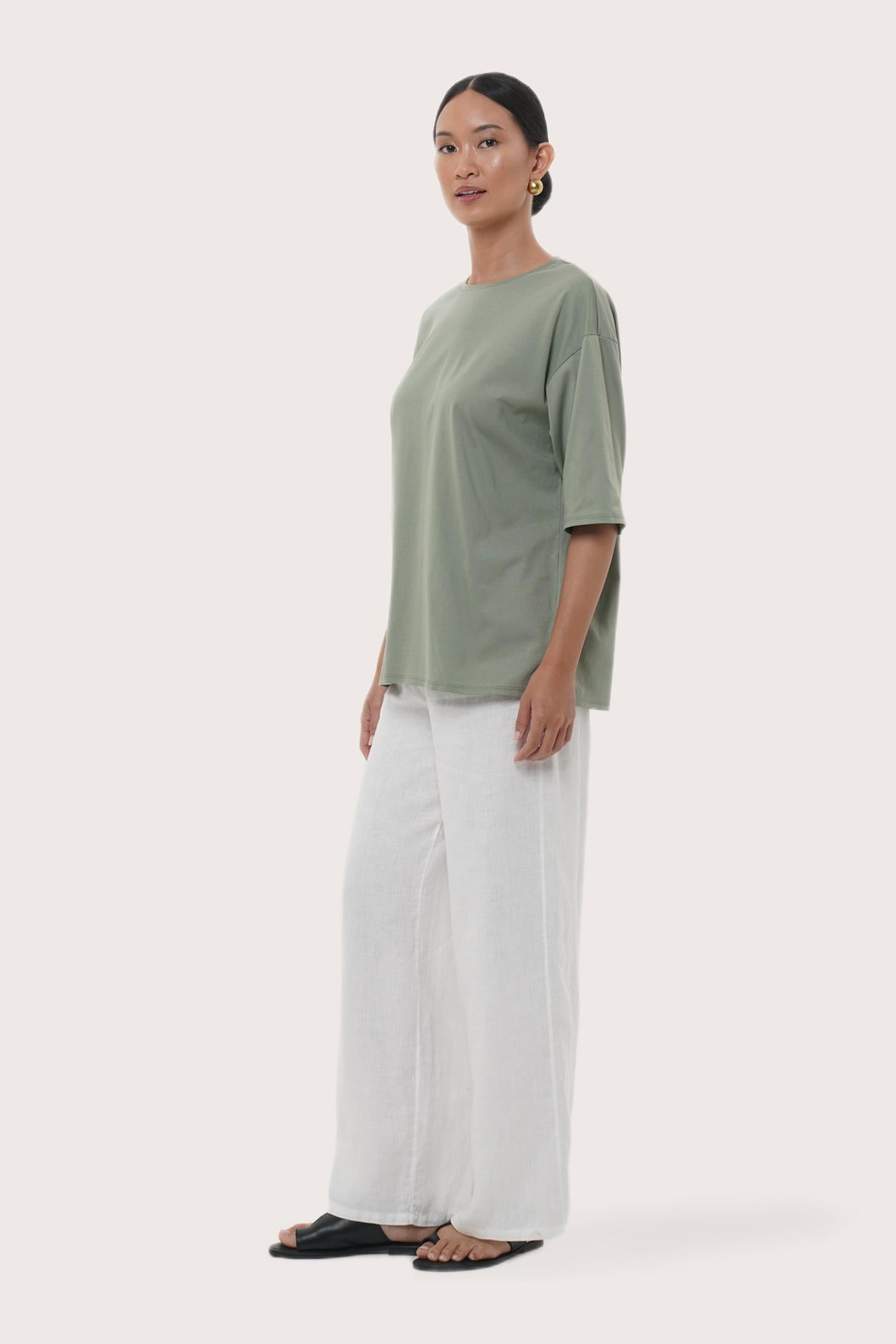 By The Sea Bali Side profile of the Serva Loose T-Shirt showcasing its relaxed fit and soft drape