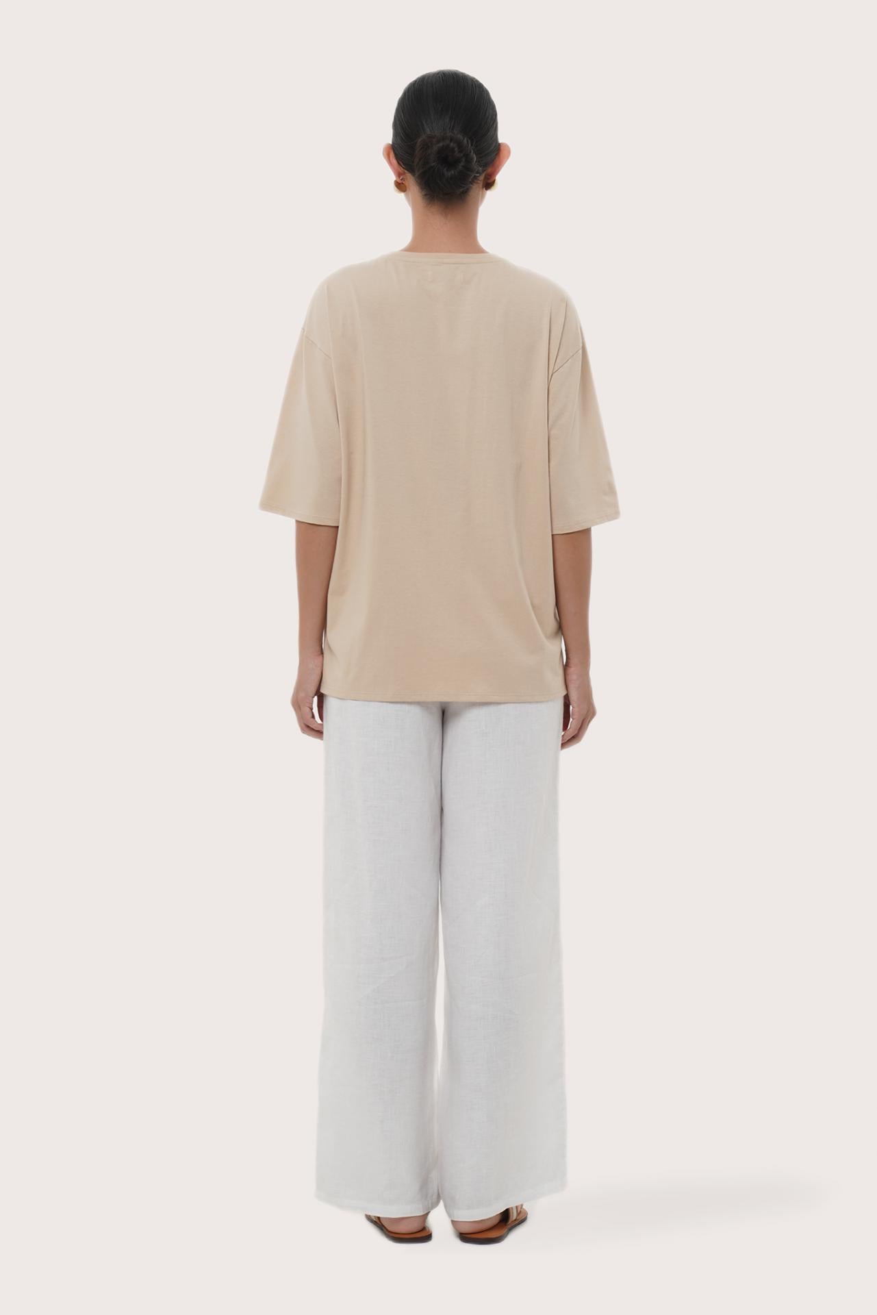 By The Sea Bali Back view of the Serva Loose T-Shirt in Pastel Yellow
