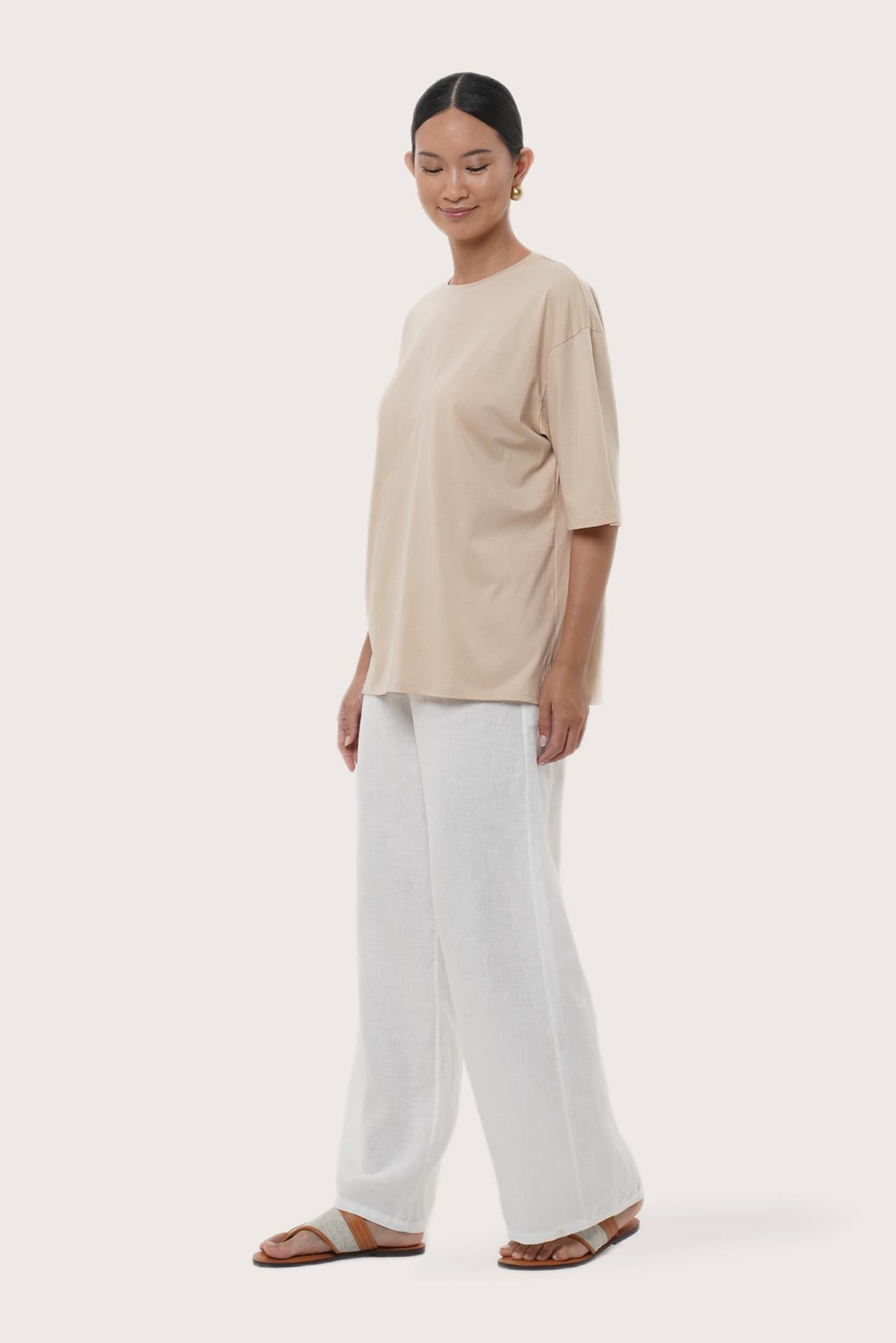 By The Sea Bali Side profile of the Serva Loose T-Shirt showcasing its relaxed fit and soft drape