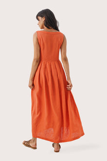 Back view of the Shino Maxi Dress Orange highlighting the garment shape and drape