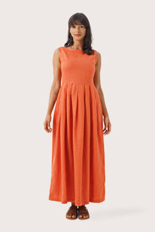 Woman wearing the Shino Maxi Dress Orange designed for effortless resortwear and tropical living by By The Sea Bali
