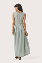 Back view of the Shino Maxi Dress Sage highlighting the garment shape and drape