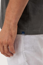 Angled detail of the Skala T-Shirt Cenere by By The Sea Bali – refined craftsmanship up close