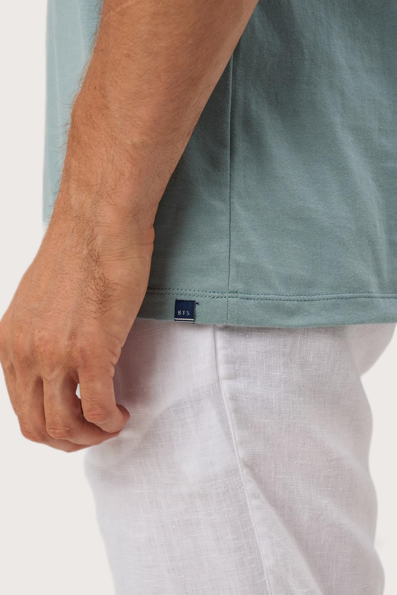 Angled detail of the Skala T-Shirt Sage by By The Sea Bali – refined craftsmanship up close