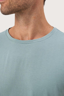 Close-up of the Skala T-Shirt Sage by By The Sea Bali – exceptional fabric quality and texture