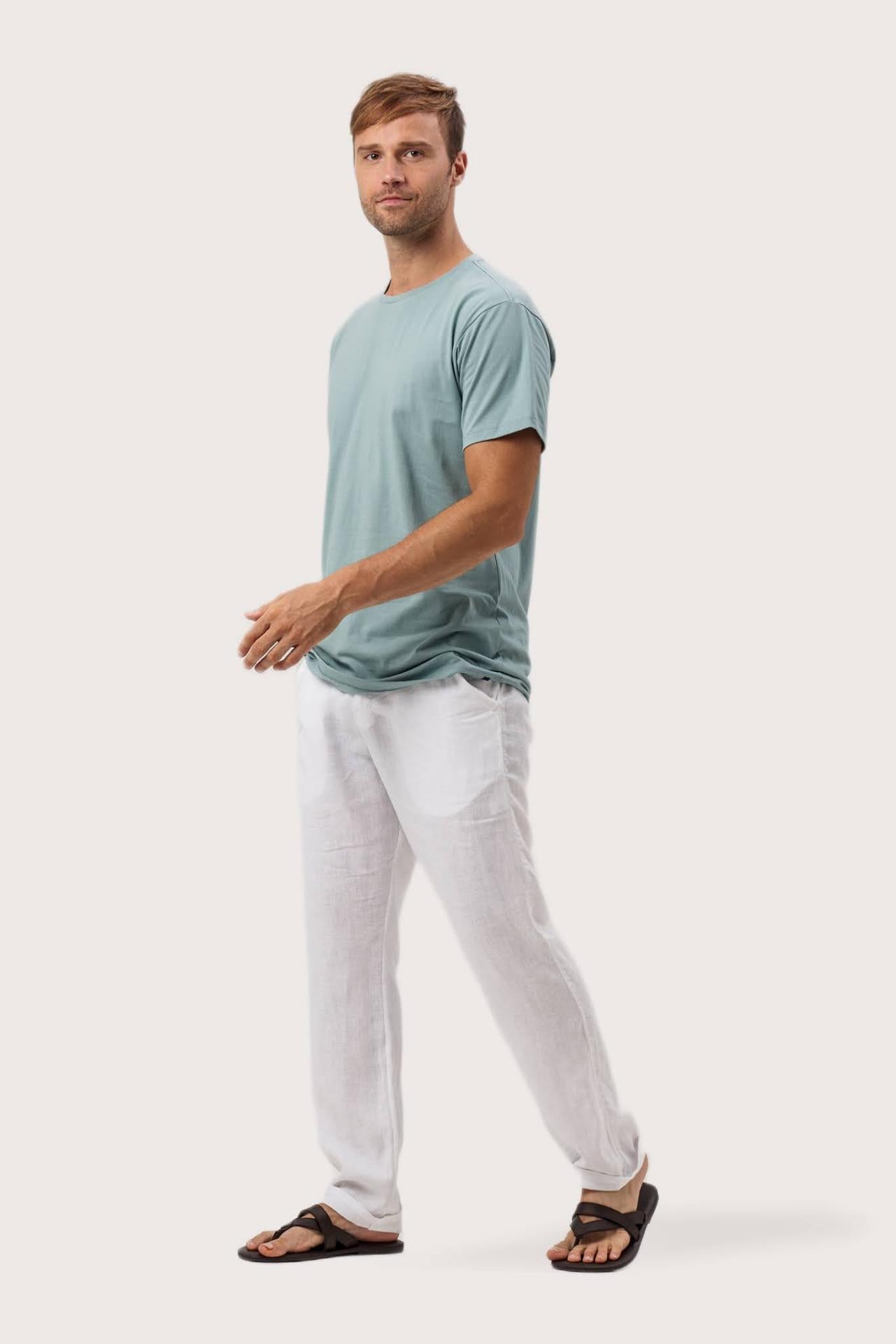 Side profile of the Skala T-Shirt Sage by By The Sea Bali – relaxed drape and understated island elegance