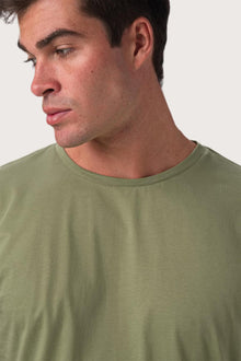 Close-up of the Skala T-Shirt Verde by By The Sea Bali – exceptional fabric quality and texture