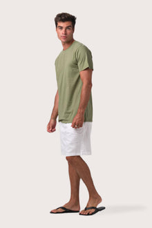 Side profile of the Skala T-Shirt Verde by By The Sea Bali – relaxed drape and understated island elegance