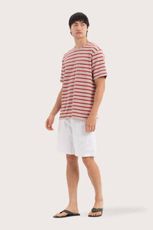 Side profile of the Striped Cotton T-shirt Red Mix by By The Sea Bali – relaxed drape and understated island elegance