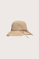 Luxury resort styling featuring the Summer Hat in a tropical seaside setting