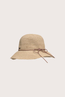 Luxury resort styling featuring the Summer Hat in a tropical seaside setting