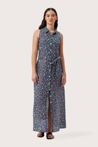 Woman wearing the Sunniva Maxi Linen Dress Sari Gris designed for effortless resortwear and tropical living by By The sea Bali