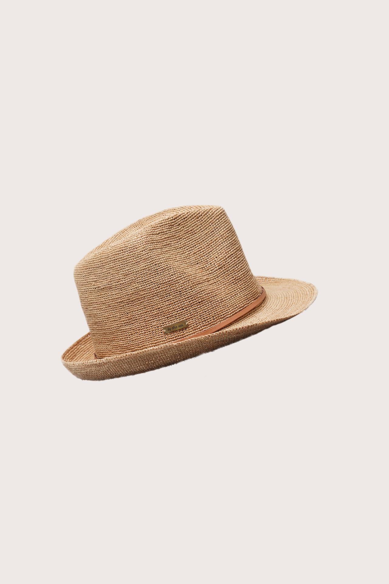 Angled view of the Sunset Hat emphasizing its sophisticated silhouette and natural elegance
