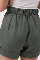 Close up detail of the Taloo Linen Bermuda Foglie Dark Green  highlighting craftsmanship and design features