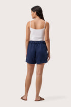 Back view of the Taloo Linen Bermuda La Brisa Navy highlighting the garment shape and drape