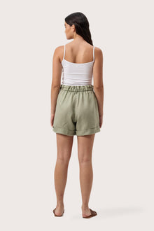 Back view of the Taloo Linen Bermuda Sage highlighting the garment shape and drape