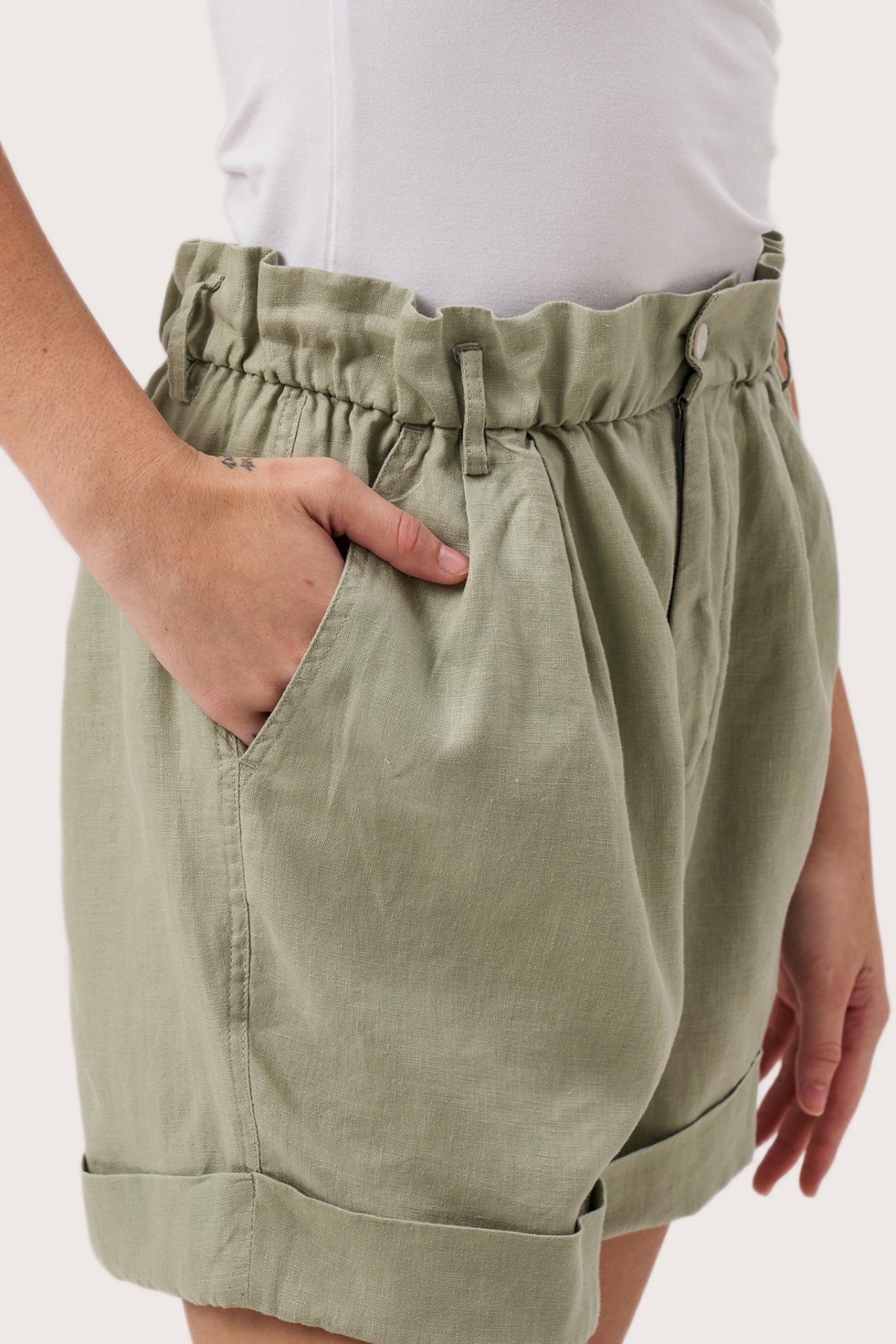 Close up detail of the Taloo Linen Bermuda Sage highlighting craftsmanship and design features