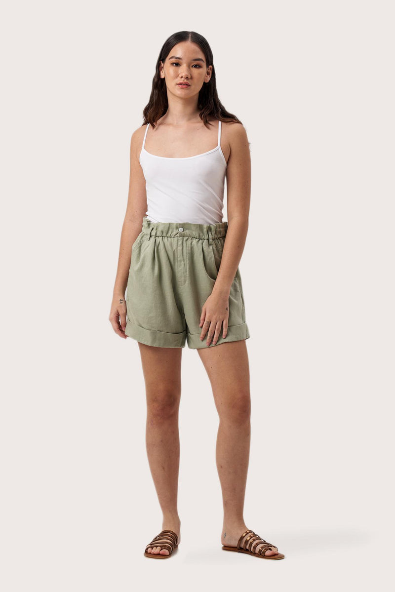 Woman wearing the Taloo Linen Bermuda Sage designed for effortless resortwear and tropical living by By The Sea Bali