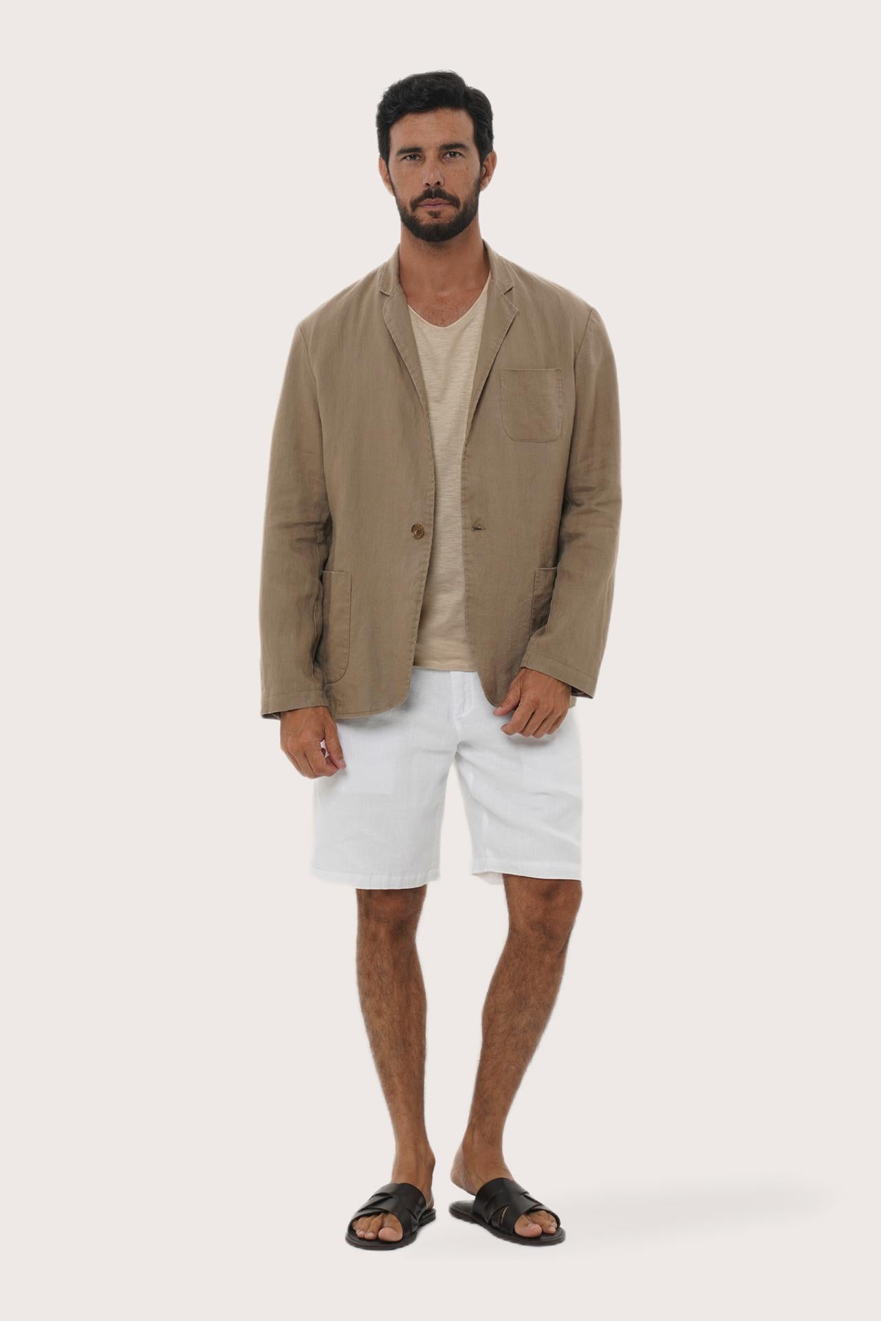 Model wearing the brown linen Tenggara blazer by By The Sea Bali