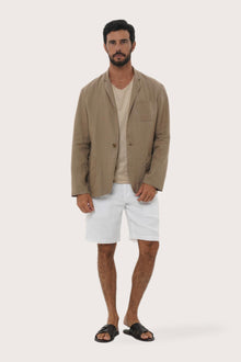 Model wearing the brown linen Tenggara blazer by By The Sea Bali