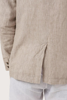 Detailed back view highlighting the linen construction and relaxed silhouette