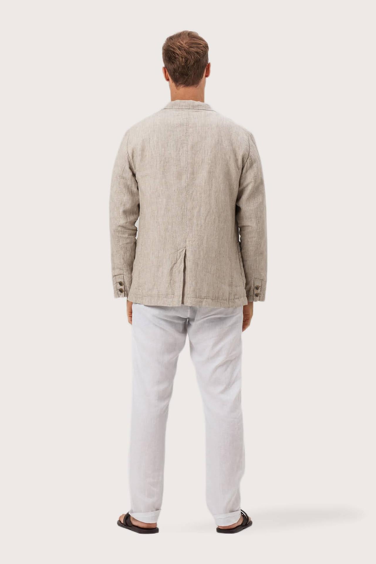Back view of the crema linen jacket with a relaxed and contemporary silhouette