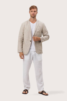 Model wearing the crema linen Tenggara jacket by By The Sea Bali