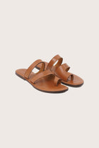 Terra sandal in marrone front view showcasing elegant straps and minimalist resort aesthetic