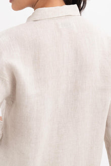 Back detail of the Tifa Linen Shirt Creme highlighting the garment shape and drape.