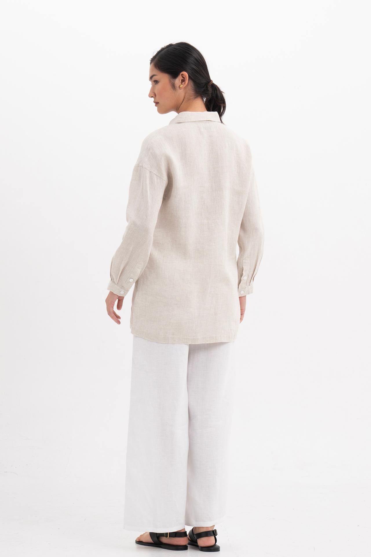 Back view of the Tifa Linen Shirt Creme highlighting the garment shape and drape.