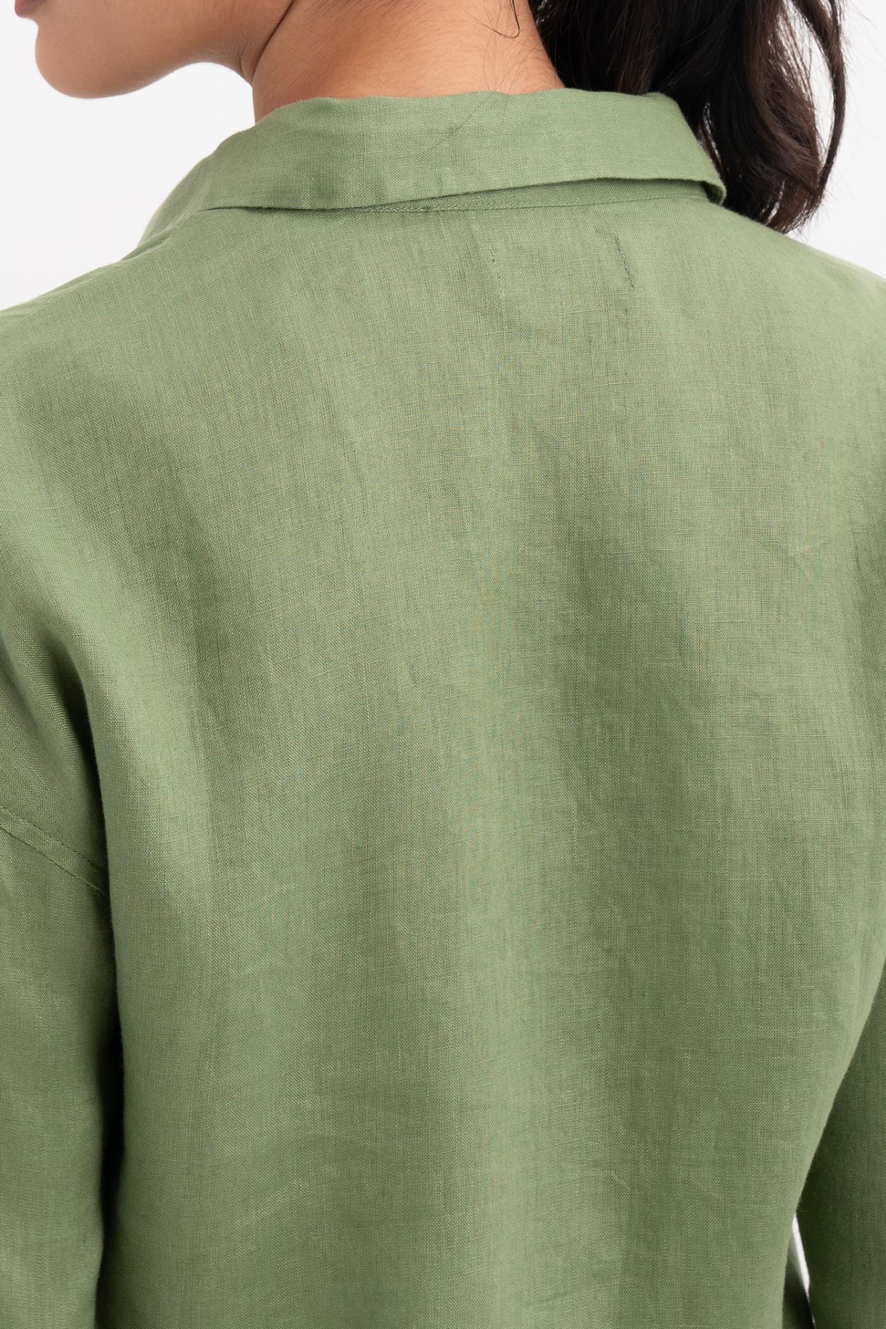 Close up back view of the Tifa Linen Shirt Green highlighting the garment shape and drape.
