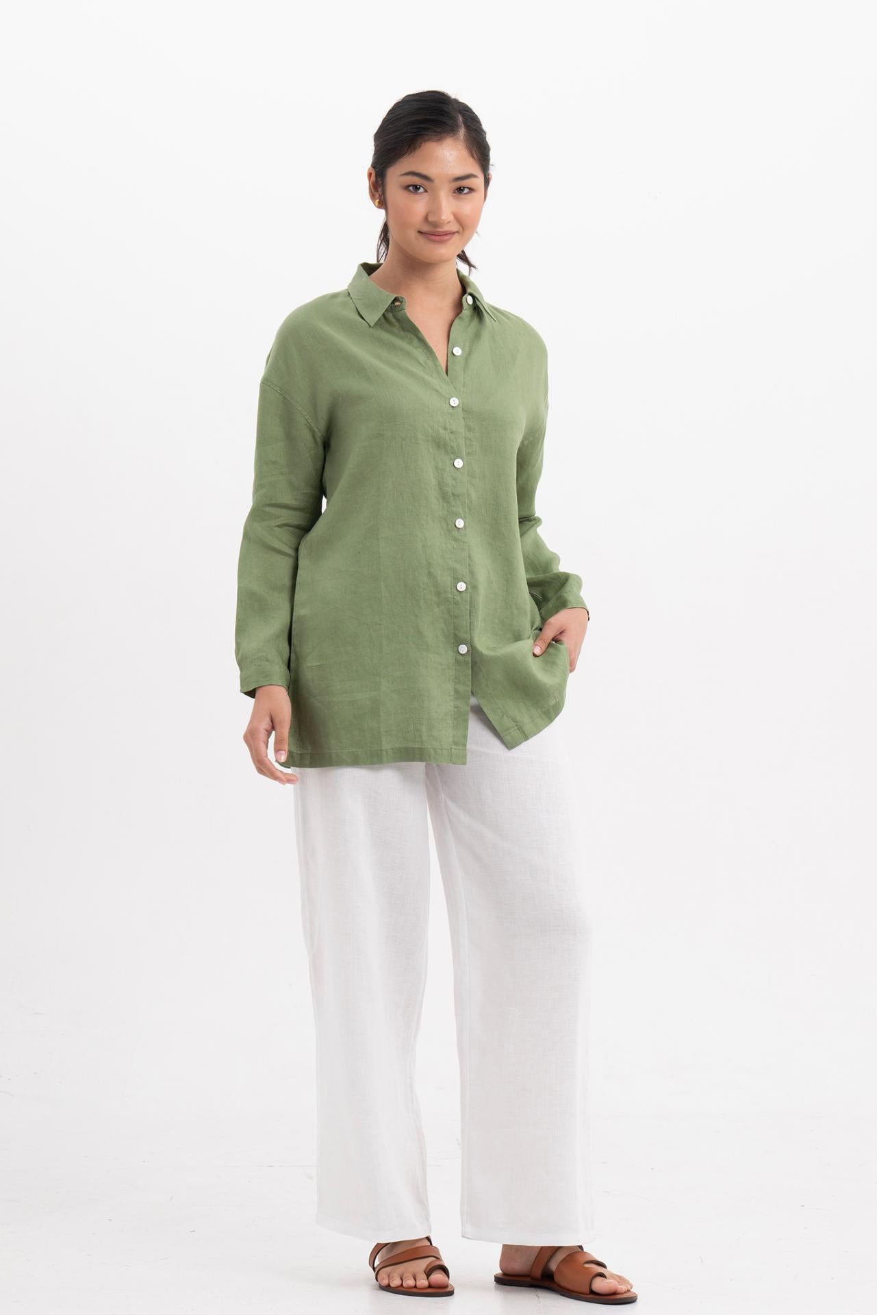 Side profile of the Tifa Linen Shirt Green showing its cut and natural movement.