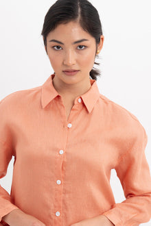 Front view detail of the Tifa Linen Shirt Orange highlighting craftsmanship and design features.