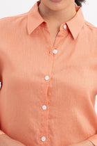 Close up detail of the Tifa Linen Shirt Orange highlighting craftsmanship and design features.