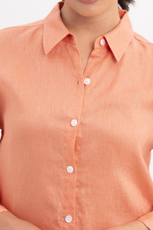 Close up detail of the Tifa Linen Shirt Orange highlighting craftsmanship and design features.