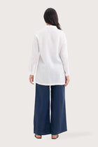 Back view of the Tifa Linen Shirt White highlighting the garment shape and drape.