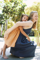Flowing movement of Tilly Kids Linen Dress designed for airy summer comfort