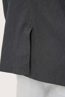 Detailed back view highlighting the tailored silhouette and premium craftsmanship