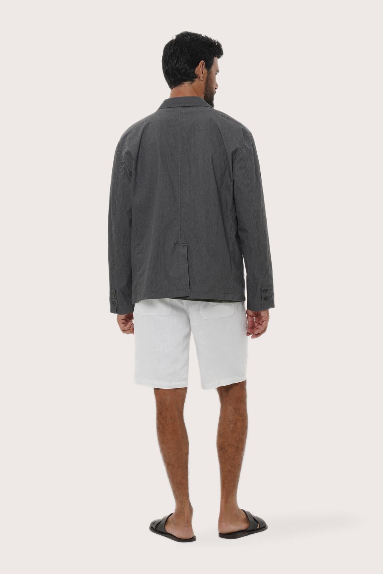 Back view of the dark grey blazer with a tailored and contemporary silhouette