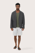 Model wearing the dark grey Varo blazer by By The Sea Bali