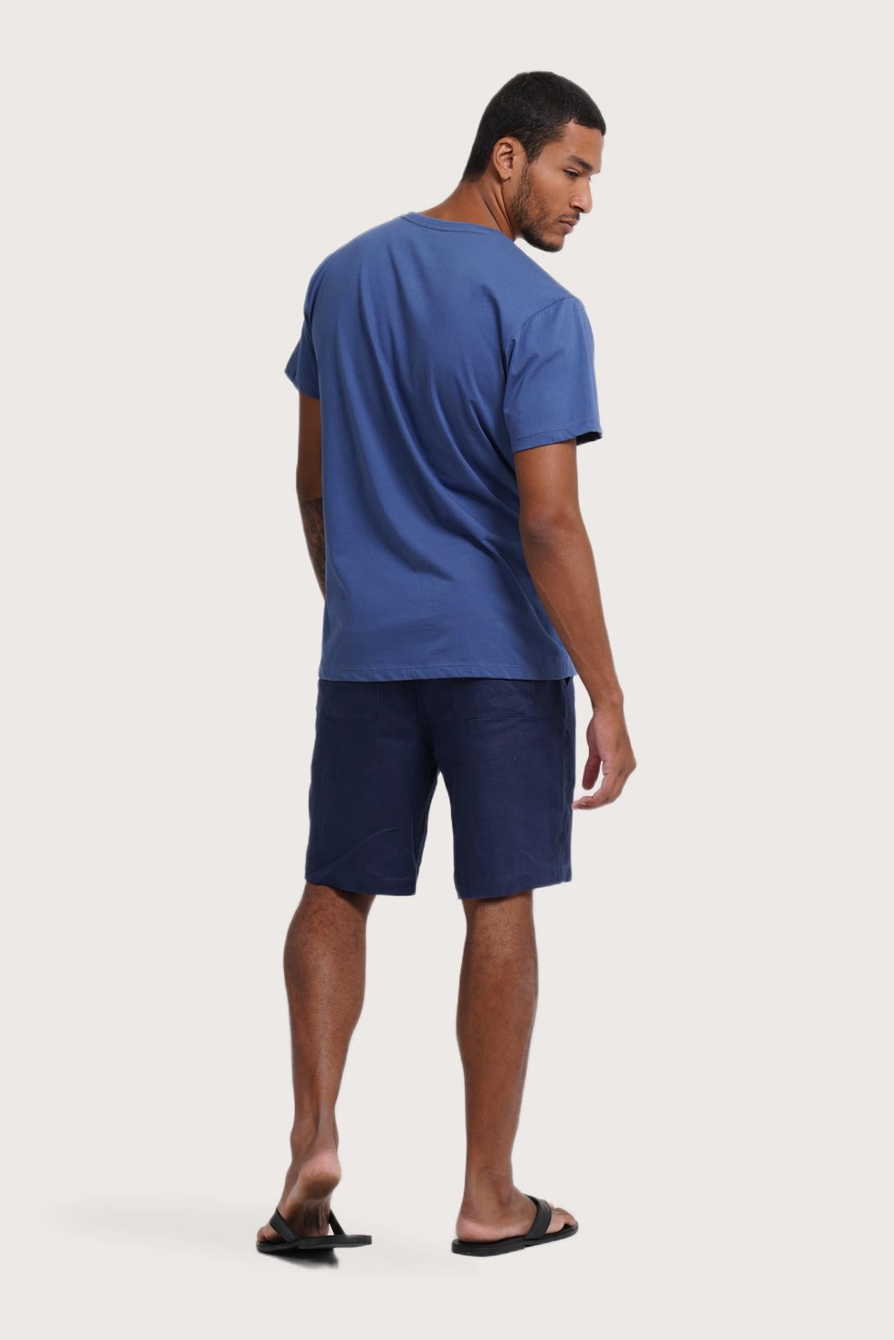 Back view of the By The Sea Bali Watu T-shirt Aksara Bali in Indigo – clean tailoring and refined craftsmanship