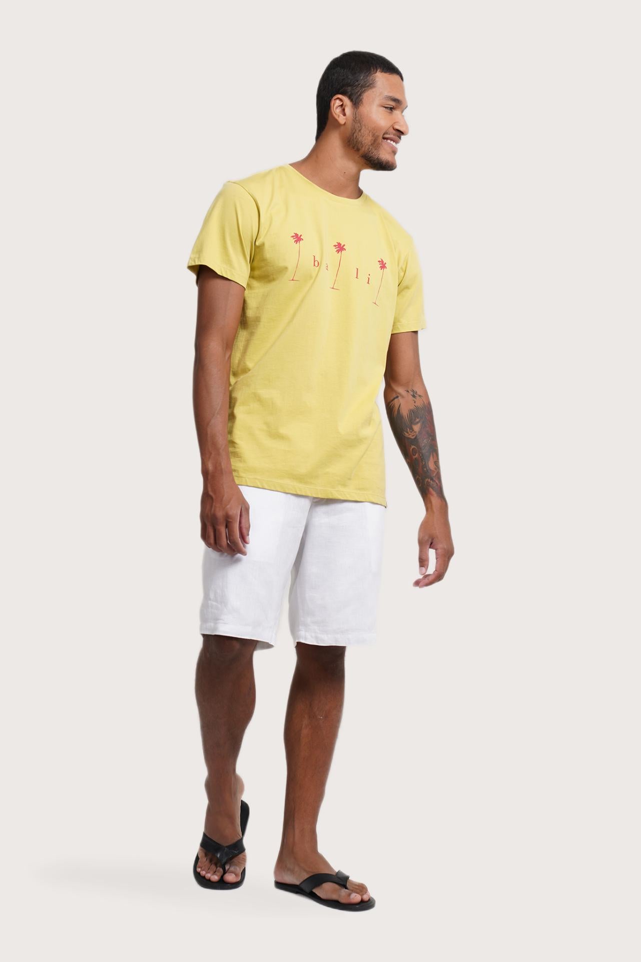 Side profile of the Watu T-shirt Bali Palm by By The Sea Bali – relaxed drape and understated island elegance