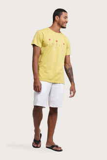 Side profile of the Watu T-shirt Bali Palm by By The Sea Bali – relaxed drape and understated island elegance