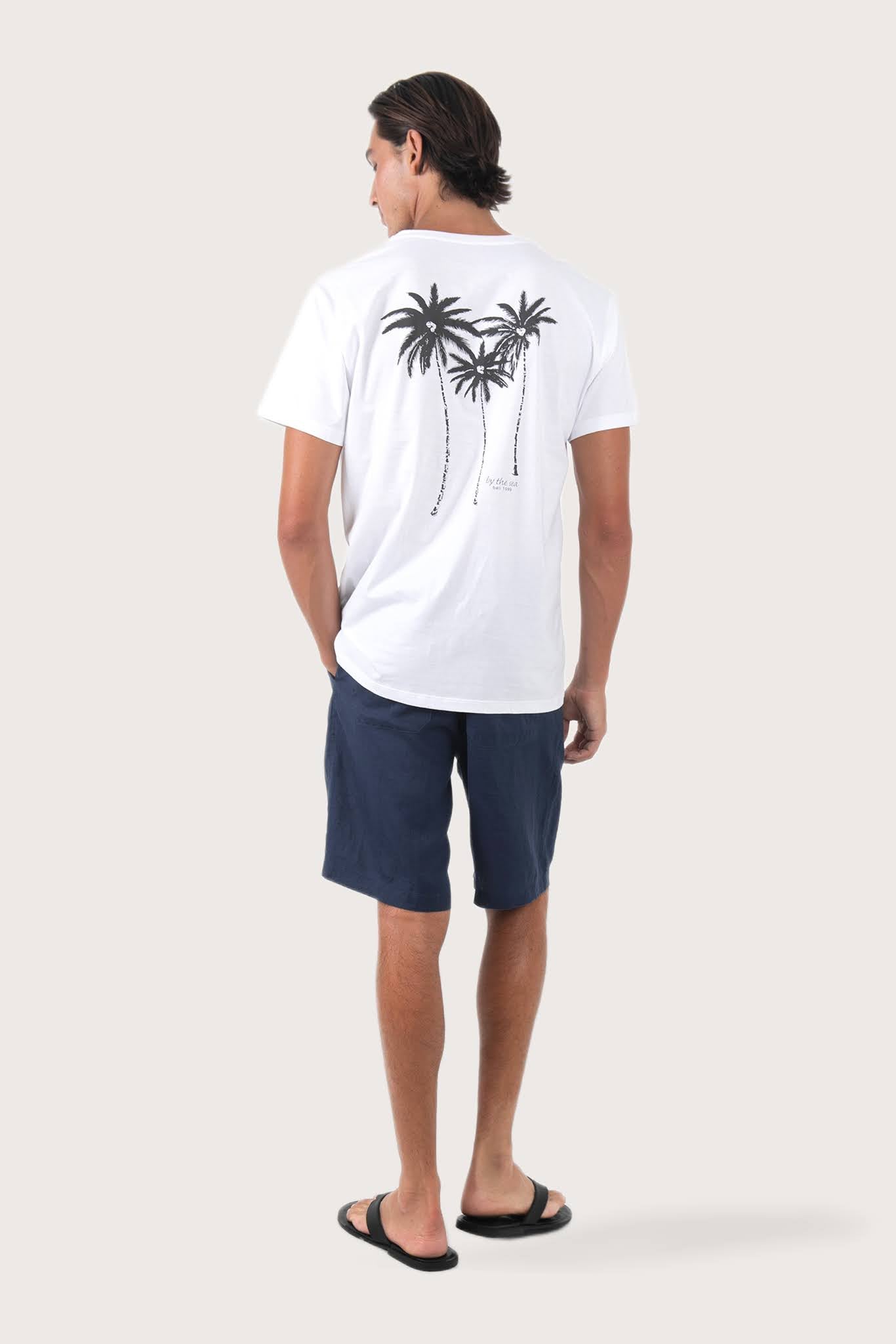 Back view of the By The Sea Bali Watu T-shirt Palm Print – clean tailoring and refined craftsmanship