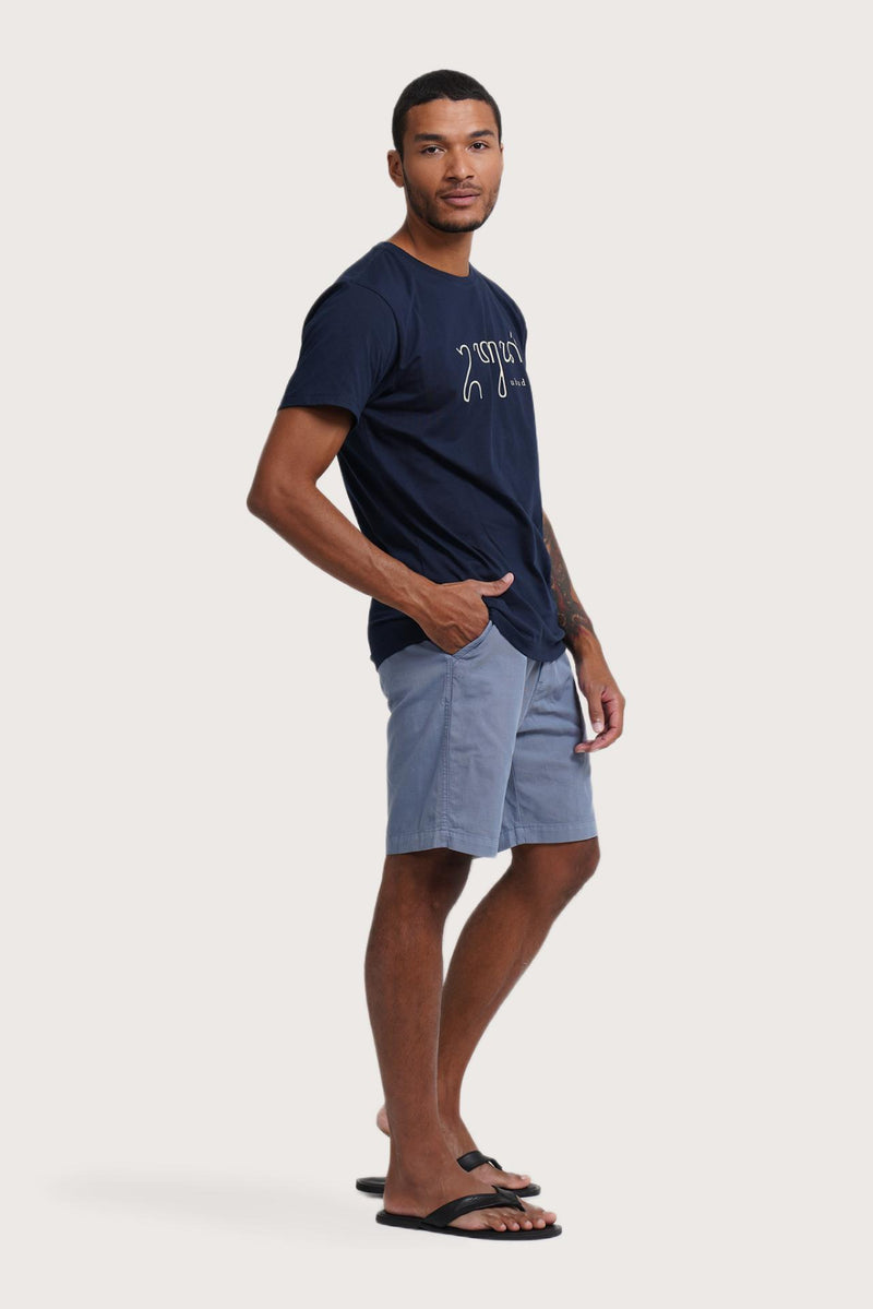 Side profile of the Watu T-shirt Ubud in Navy by By The Sea Bali – relaxed drape and understated island elegance