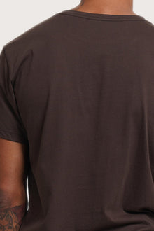 Back detail of the Watu T-shirt Uluwatu in Brown by By The Sea Bali – premium stitching and artisan quality