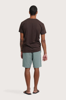 Back view of the By The Sea Bali Watu T-shirt Uluwatu in Brown – clean tailoring and refined craftsmanship
