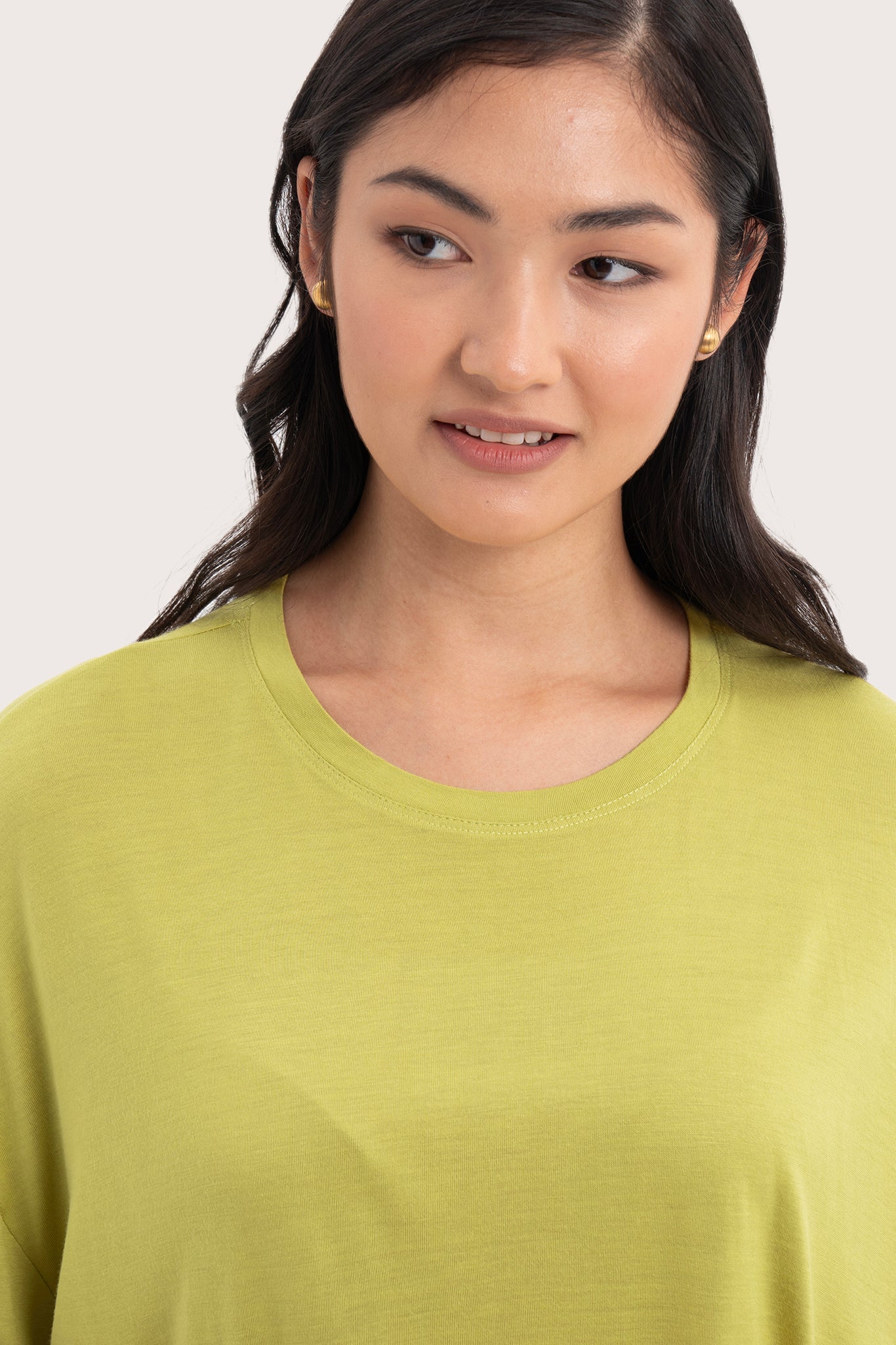 Close up front detail of the Yara Top Lime highlighting craftsmanship and design features.
