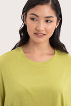 Close up front detail of the Yara Top Lime highlighting craftsmanship and design features.