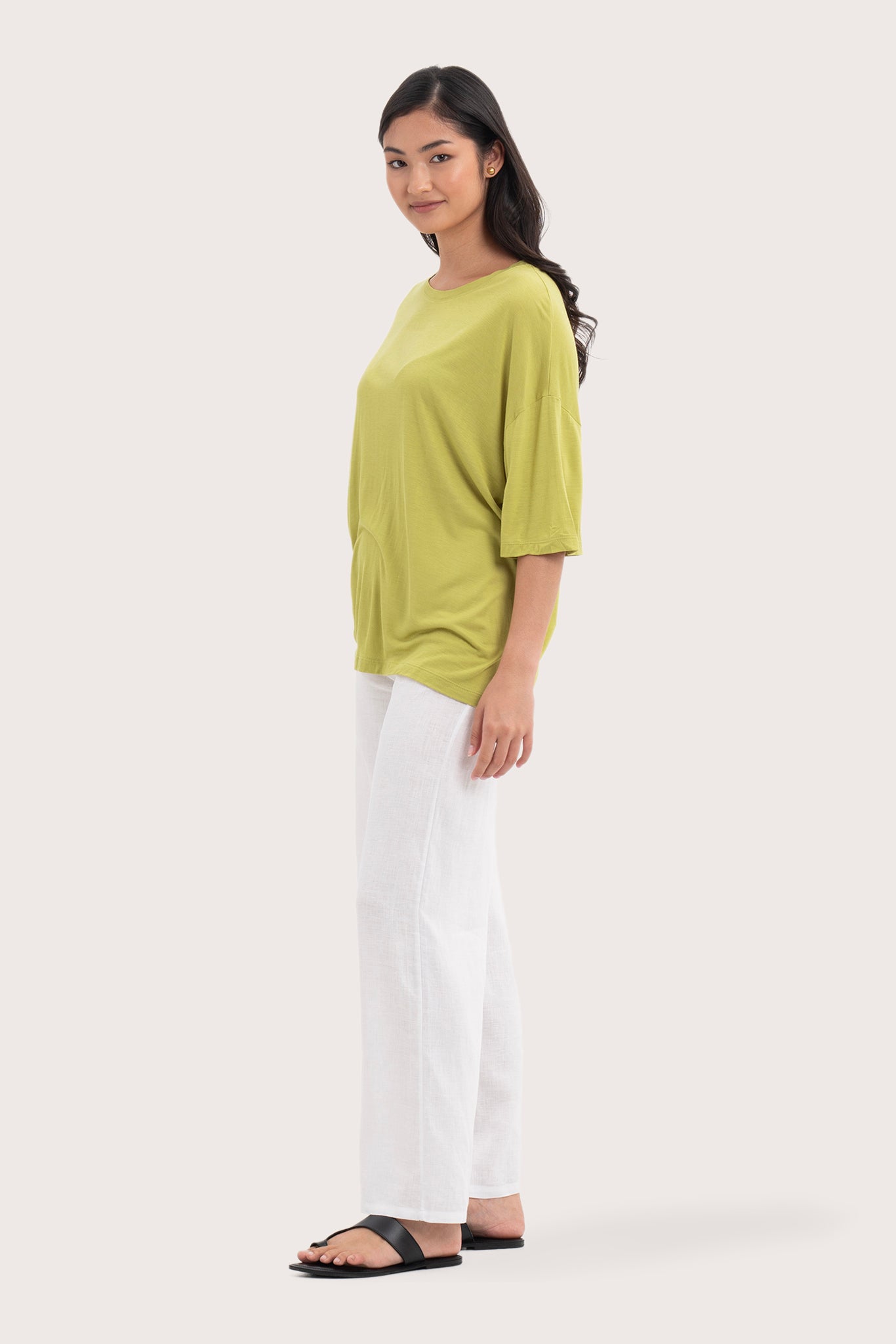 Side profile of the Yara Top Lime showing its cut and natural movement.